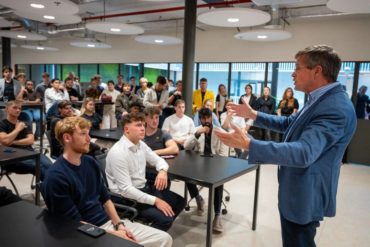 Guest speaker in front of a full classroom at Unknown